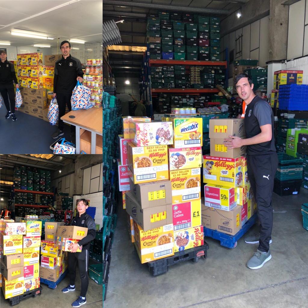James Hatch and Daniel Bobinski delivering their food purchases to the Foodbank warehouse.